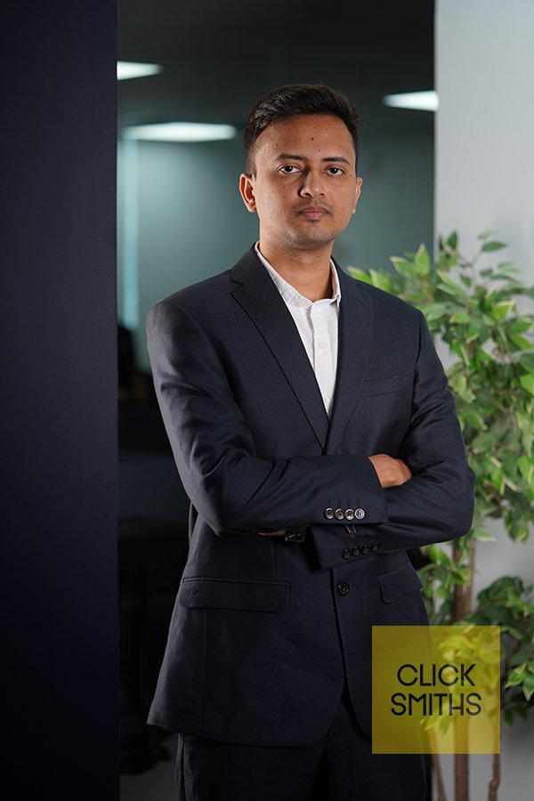 Professional man in suit, confident pose. headhsot photography by clicksmiths